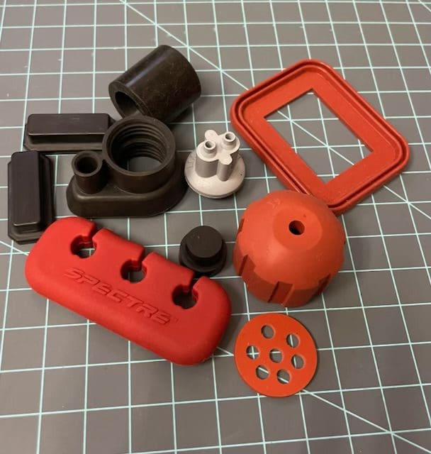 A group of various plastic parts on top of a table.