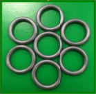 A green background with eight metal rings.