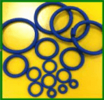 A group of blue rubber rings on top of a yellow table.